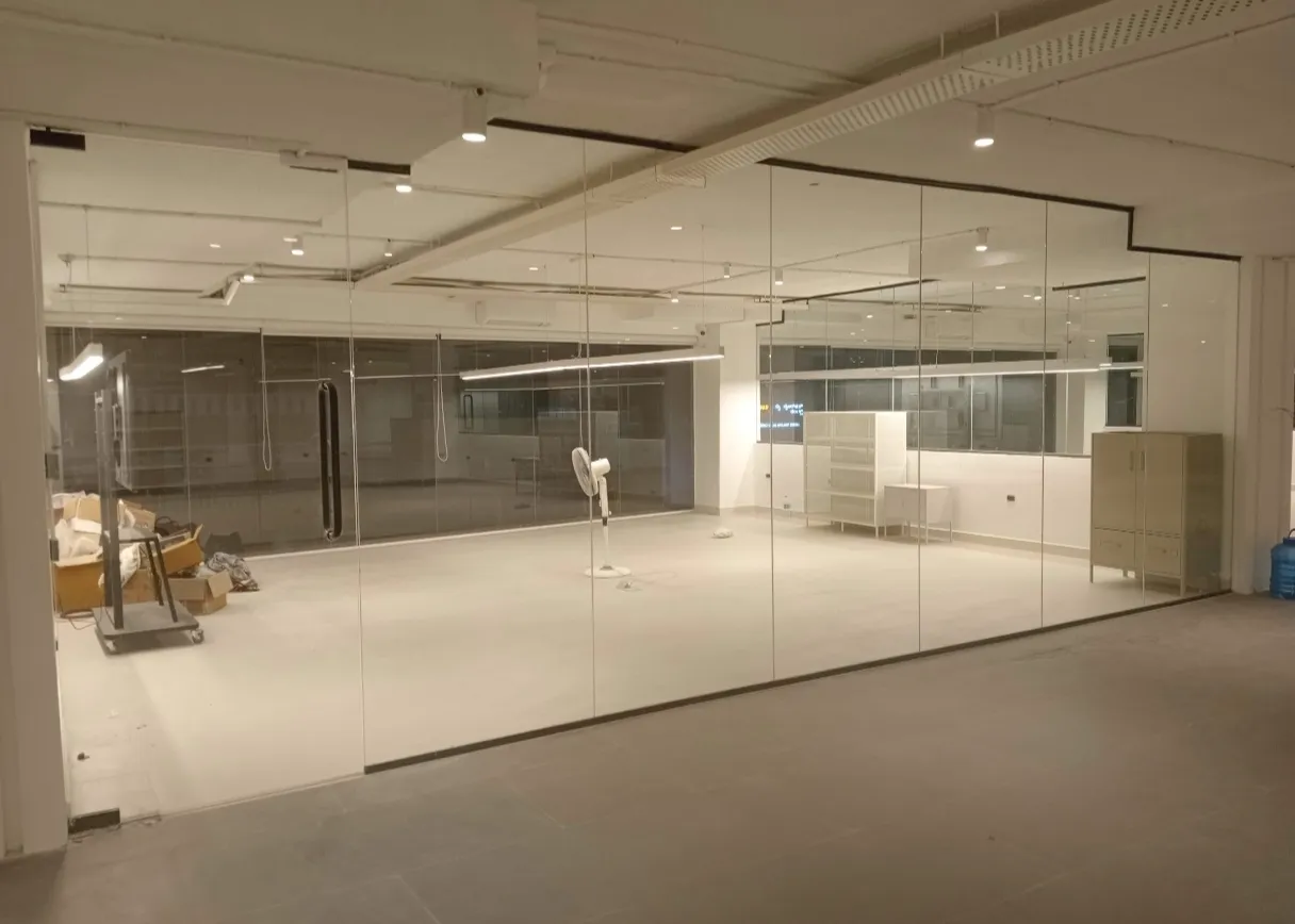 Black frame commercial glass partition and storefront glazing in Bangalore