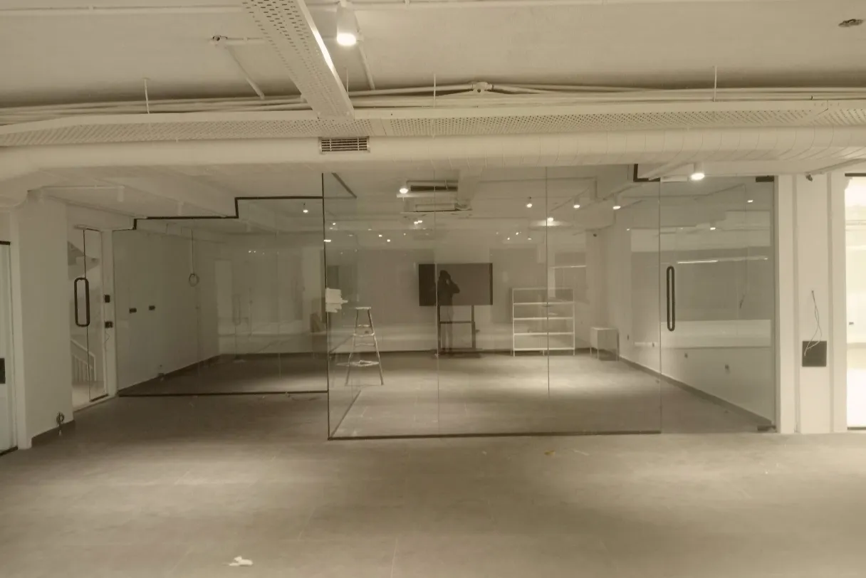 Large frameless office glass wall and cabin partition in Bangalore corporate space
