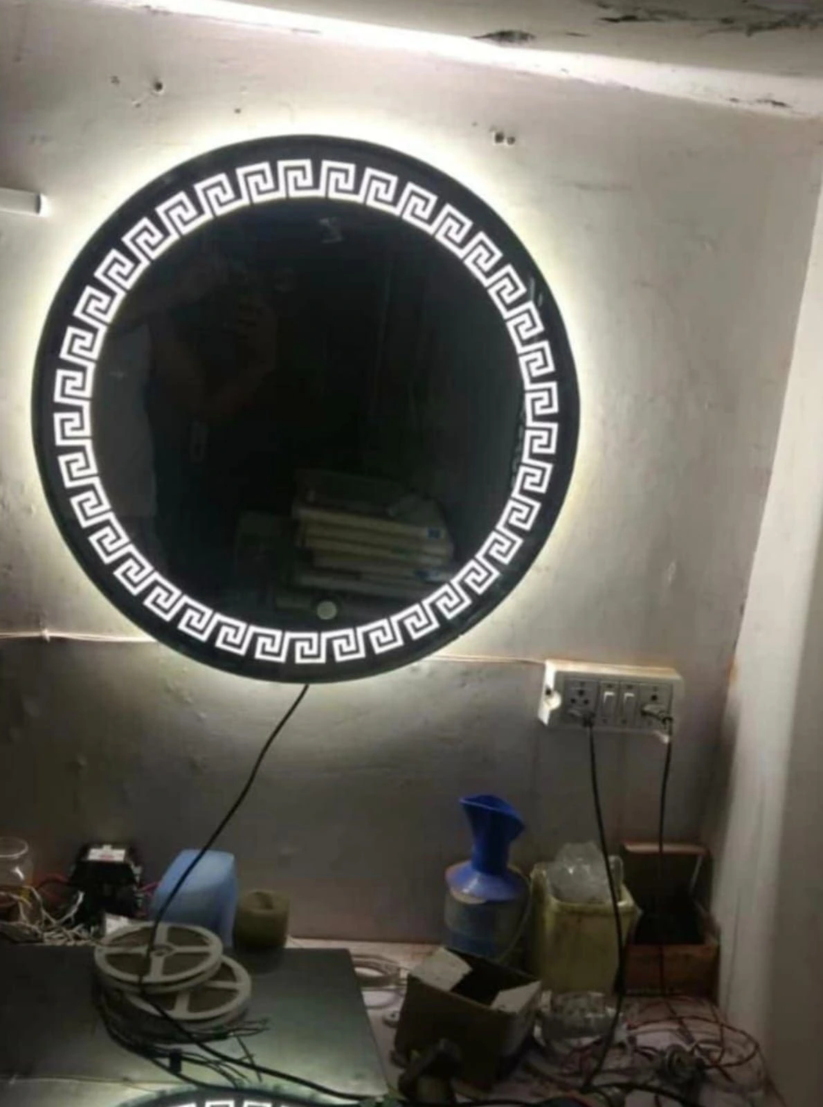 Round LED backlit bathroom mirror with Greek key border design in Bangalore
